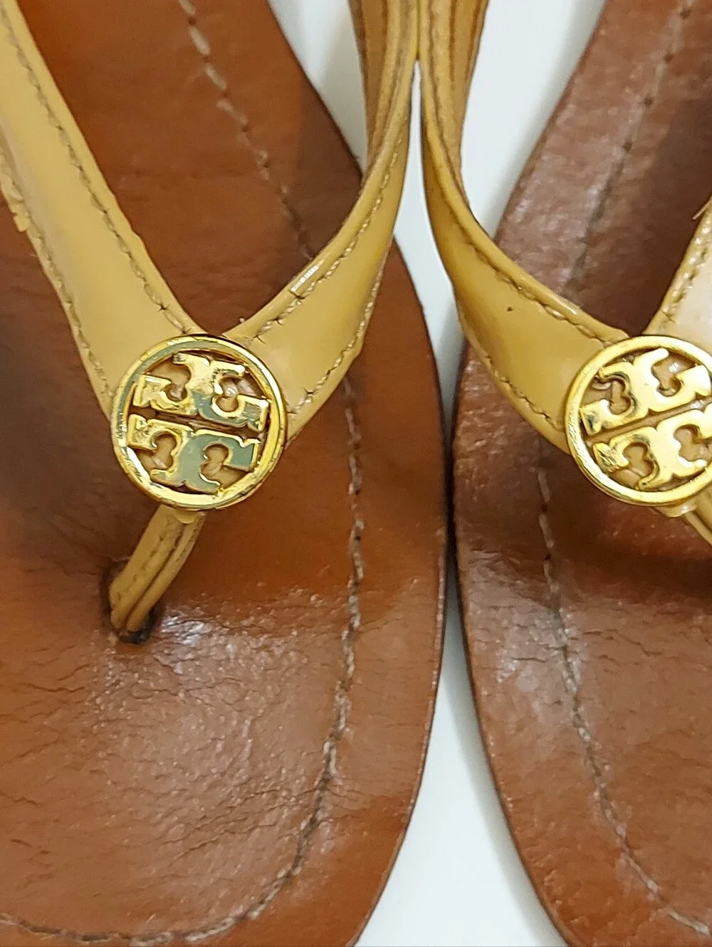 Tory Burch Brown Leather Flip Flop Sandals with Tan Straps and Gold Medallion